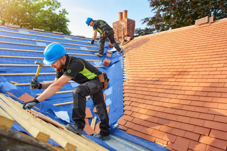 Two roofing engineers working on a roof with a central gutter